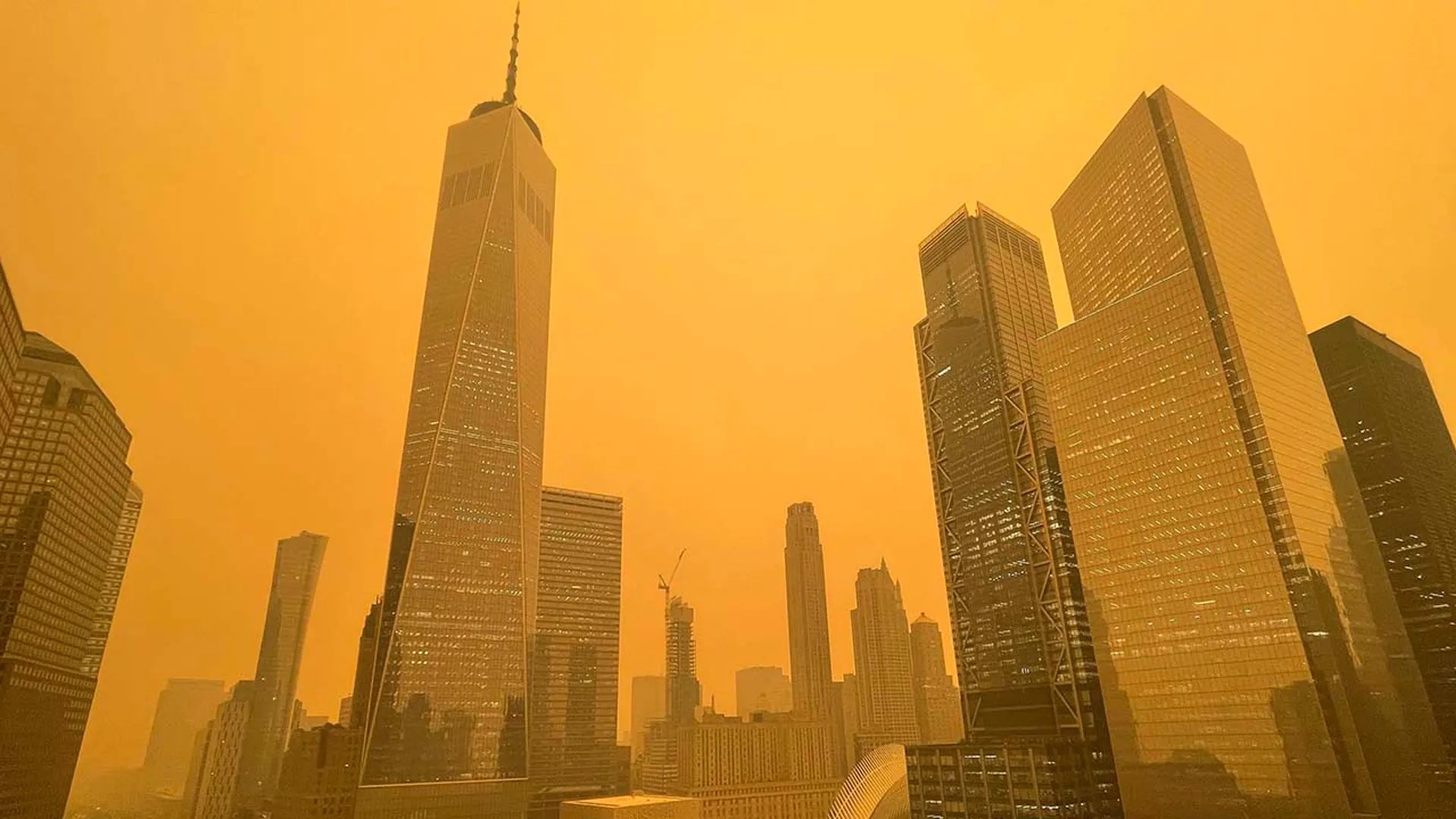 The World Trade Center silhouetted against a smokey haze.